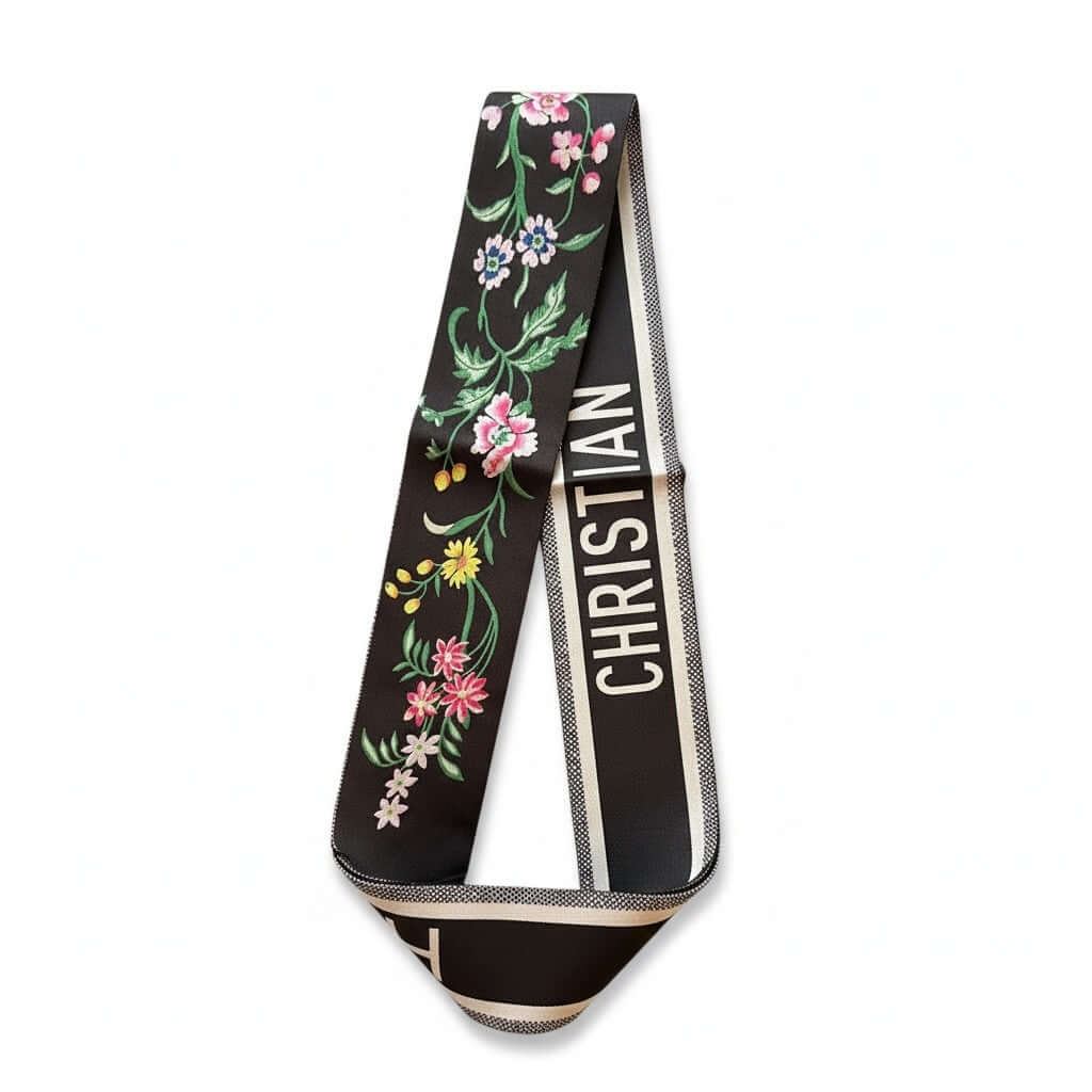 Legacy Noir Blossom Twilly with floral embroidery and designer border on a black satin-style scarf.