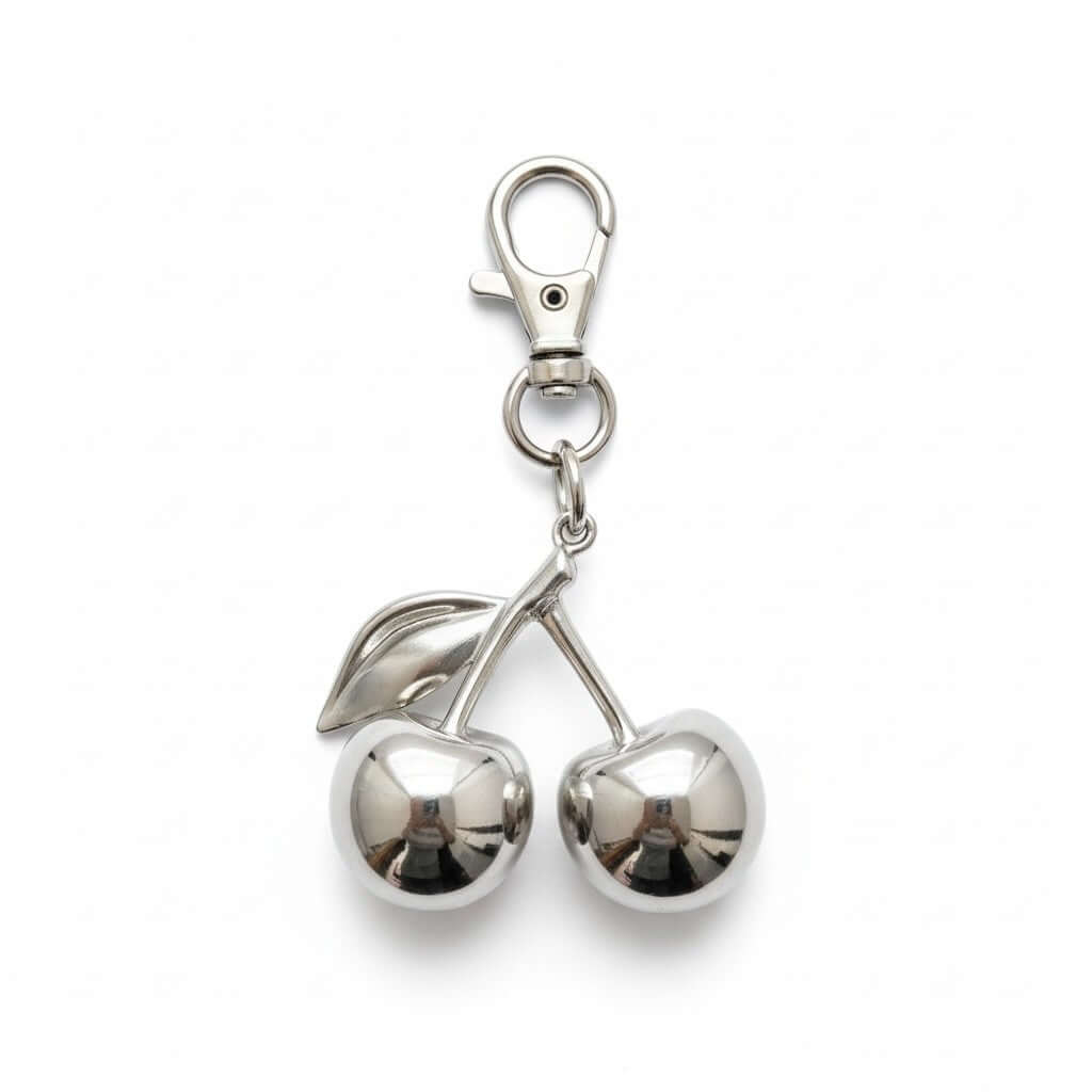 Legacy Ruby Cherry Charm featuring glossy cherry design and gold detailing for a chic handbag accessory.