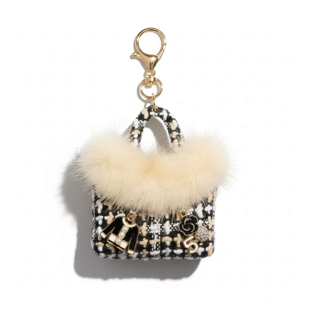 Legacy Noir Luxe Mini Charm featuring black faux fur, textured tweed, and gold enamel charms.