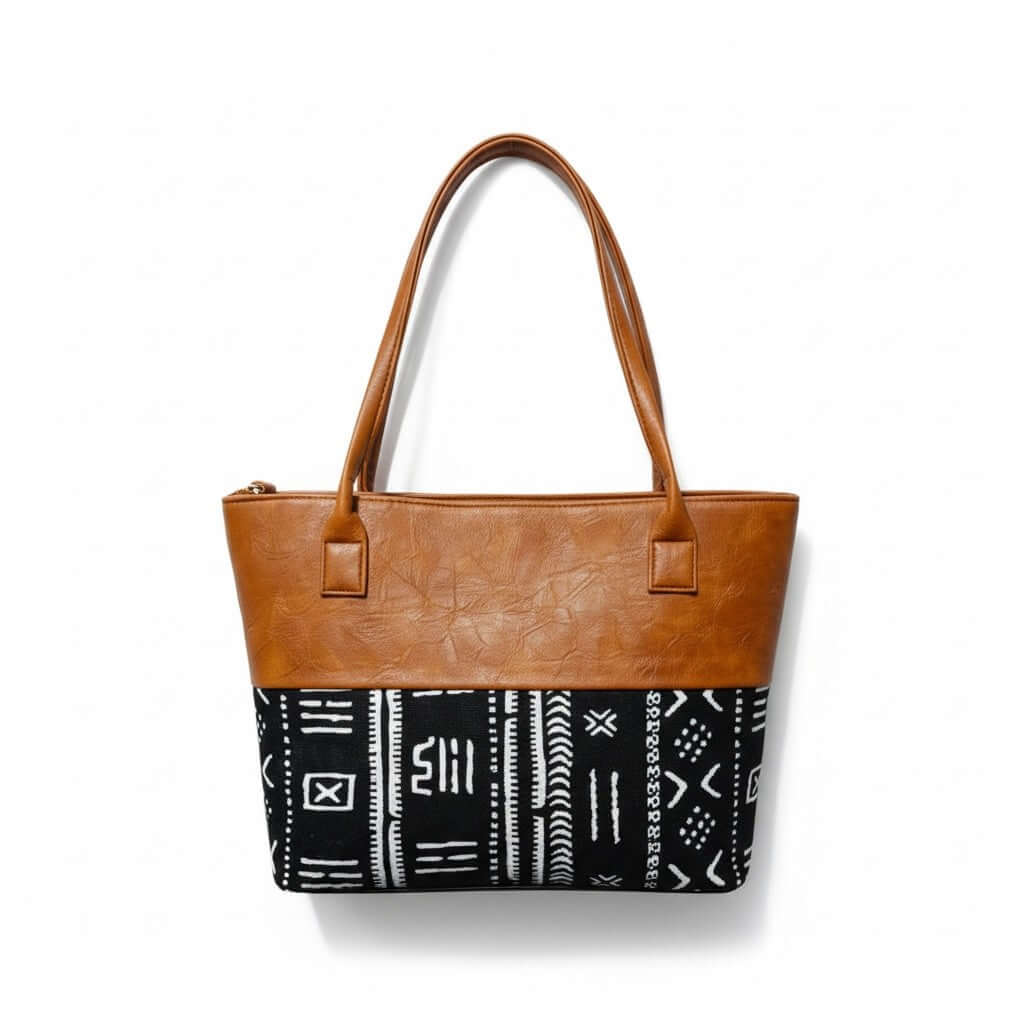 Imani Heritage Luxe Tote – Custom Handcrafted Mudcloth & Leather Bag with caramel leather and mudcloth design.