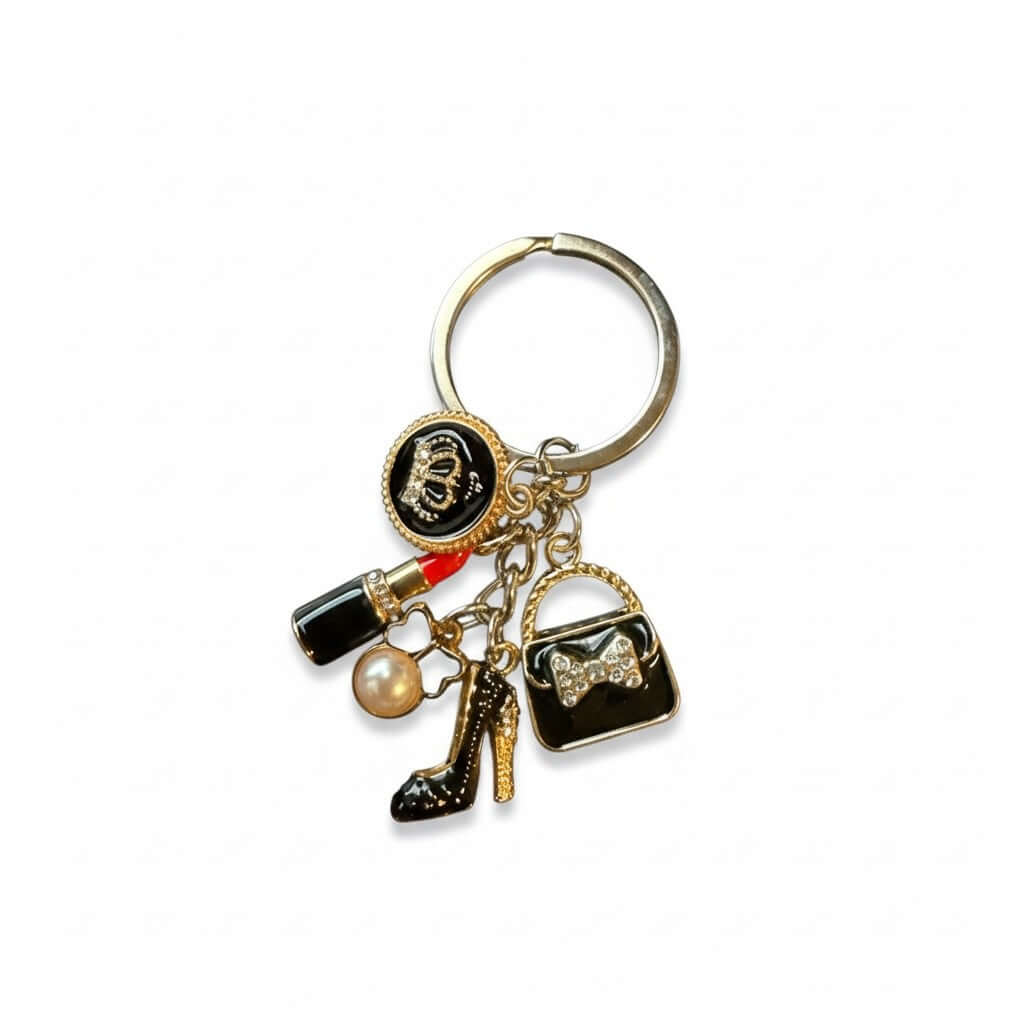 Legacy Noir Glam Charm featuring a glossy black handbag, stiletto, pearl, and red lipstick keychain.