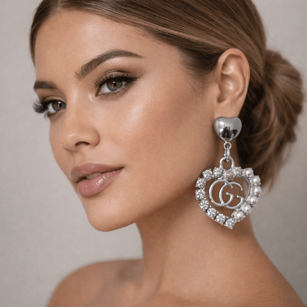 Silver Legacy Heart Pearl Earrings (Upcycled | One-of-One Statement Pair) worn by a model, showcasing elegant design and detail.
