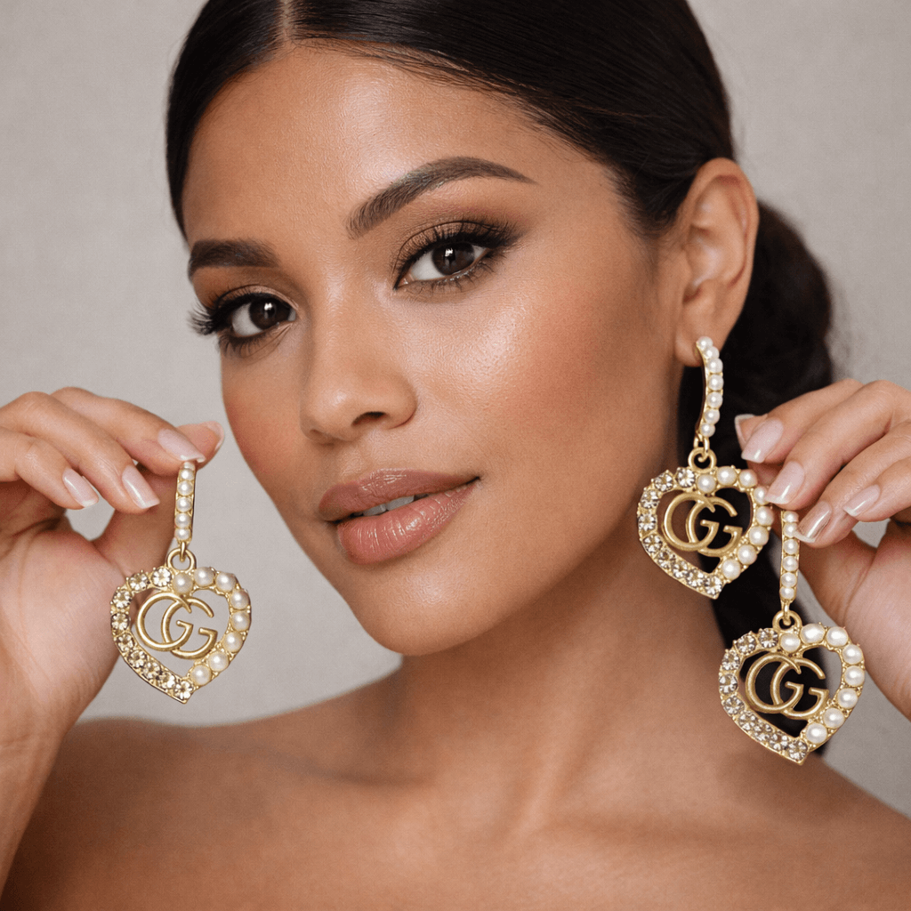 Golden Legacy Pearl Crest Earrings (Upcycled | One-of-One Statement Pair) worn by a model with radiant skin.