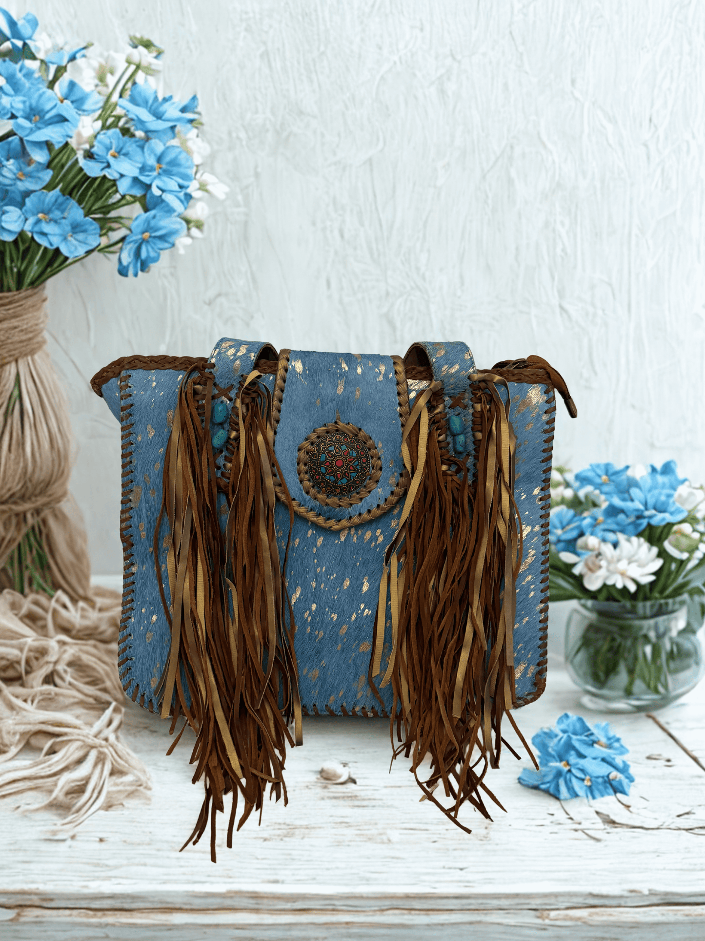 Michelle Bag- Blue featuring denim-blue base, cascading brown leather fringe, and intricate beading.