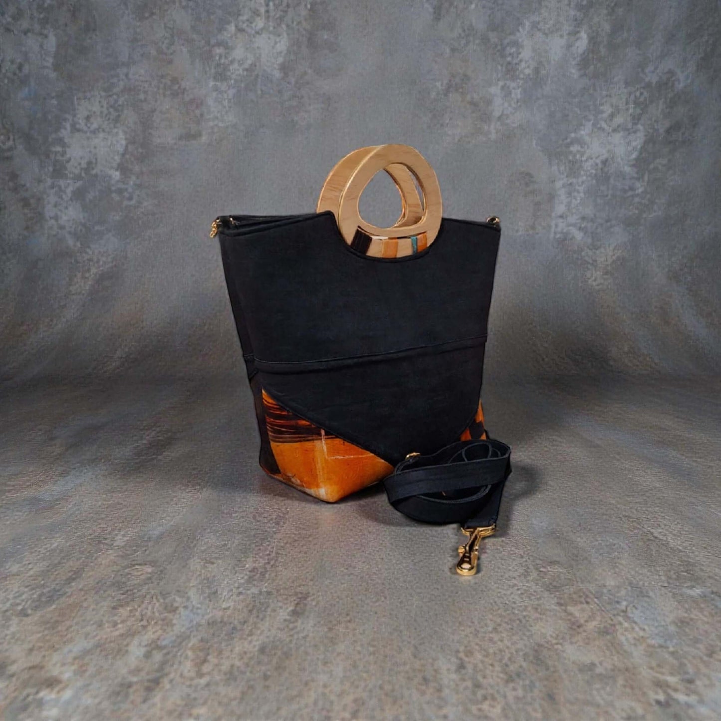 Dana Denim Artisan Handbag – Custom Handcrafted Denim & Wood Handle Bag with detachable strap on textured background.