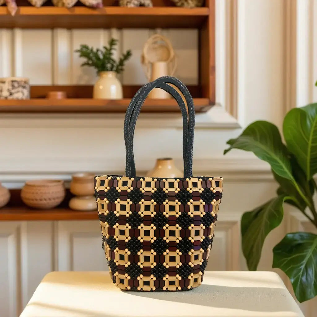 Ava Artisan Handbag – Handcrafted Leather & Wood Appliqué Couture displayed on a table with intricate design.