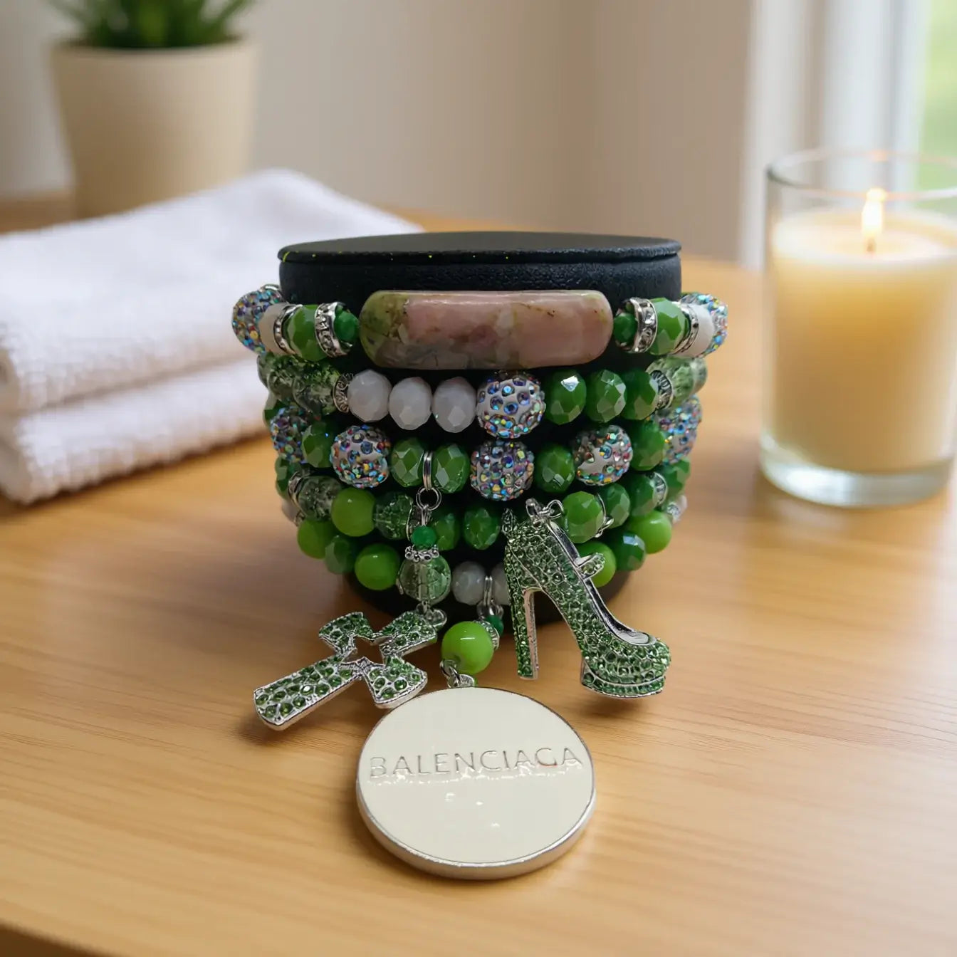 Legacy Emerald Glow Duo Set featuring a vibrant bracelet with emerald beads and sparkling charms.