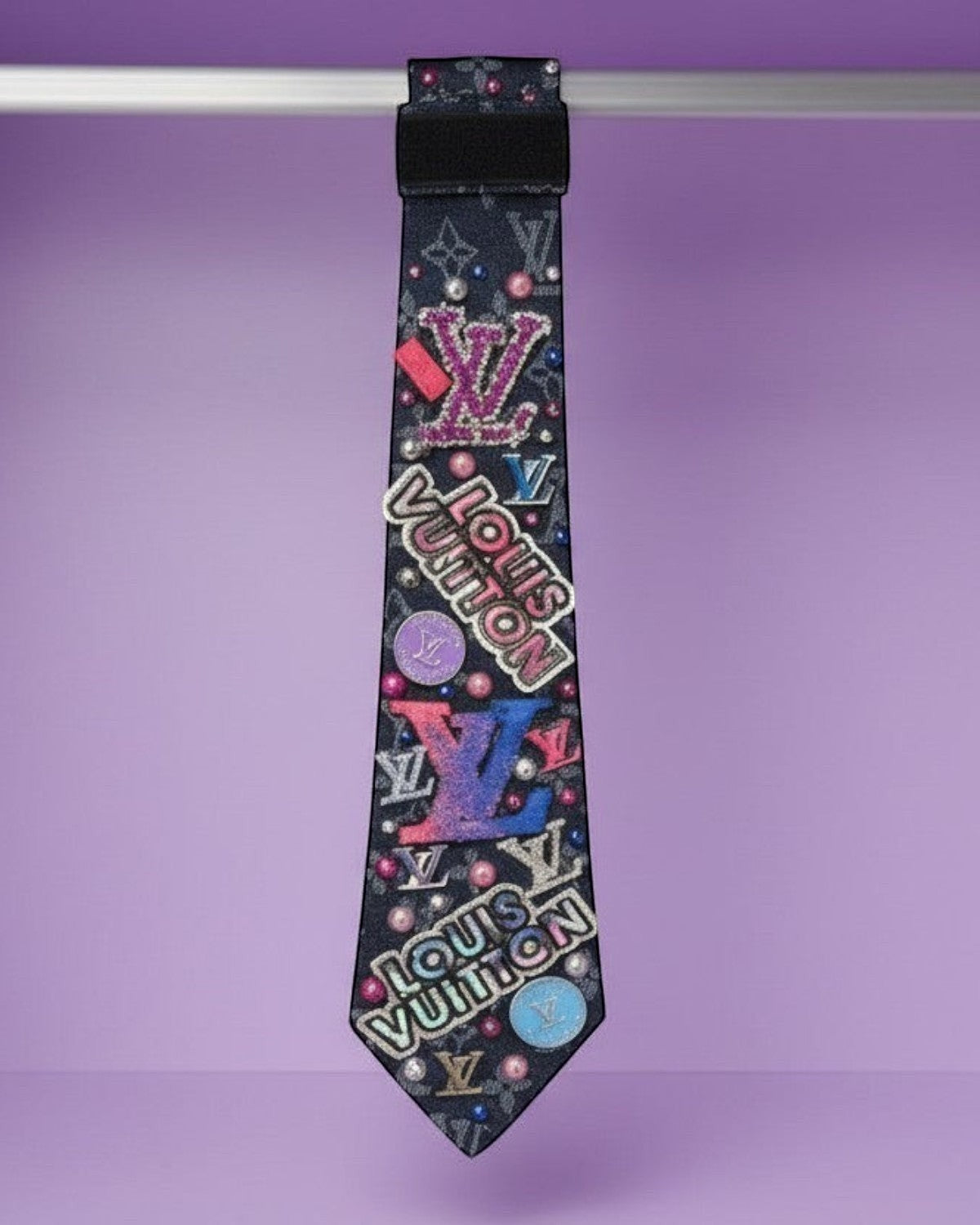 Legacy Dealz black tie with colorful logos, pearls, and glitter accents. Unique statement accessory.