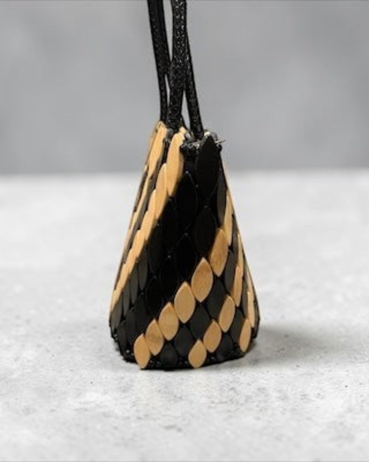 Legacy Dealz Annie Handcrafted Tote: Black & cream leather and wood appliqué bucket bag with unique scale pattern.