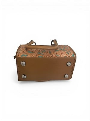 Legacy Dealz tan leather satchel with Western tooling, turquoise accents, and silver concho. Boston bag silhouette.