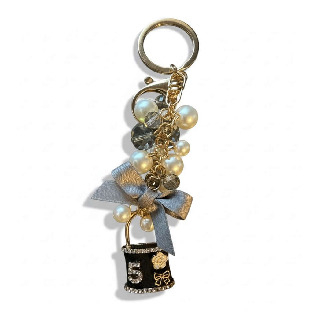 Legacy 5 Pearl Luxe Charm featuring soft pearls, crystal beads, satin bow, and No. 5 pendant for elegant accessories.