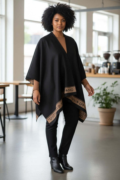 Cashmere Luxe Reversible Poncho – Noir Edition | 100% Cashmere Wrap | One-of-One Boutique Luxury worn by a model in a café.