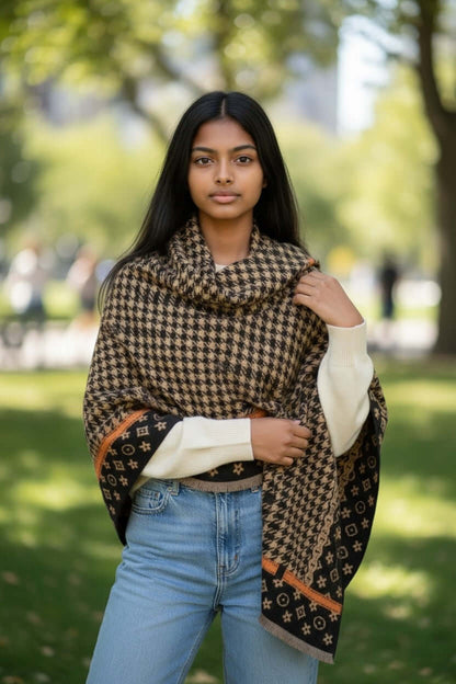Model wearing Legacy Luxe Autumn Houndstooth Heritage Wrap in a park setting, showcasing its elegant design and warm texture.