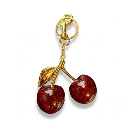 Legacy Ruby Cherry Charm featuring glossy deep-ruby cherries with luxe gold detailing.