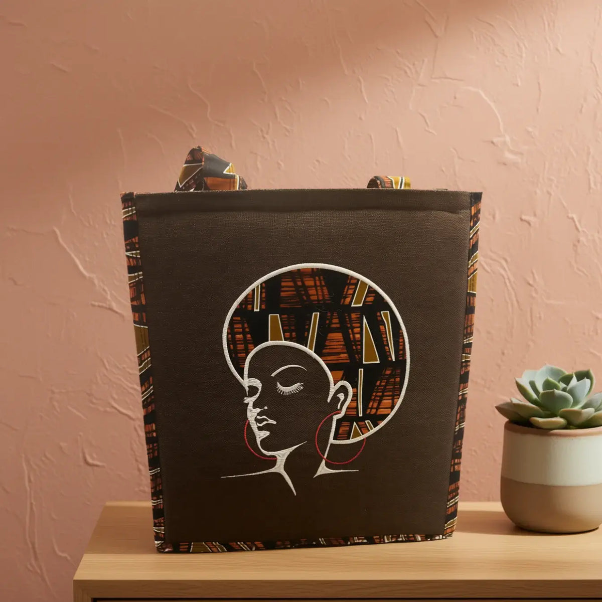 Angela Bag – Waterproof Hand-Stitched Multifunctional Tote | Amani Belle Collection with bold embroidered silhouette.