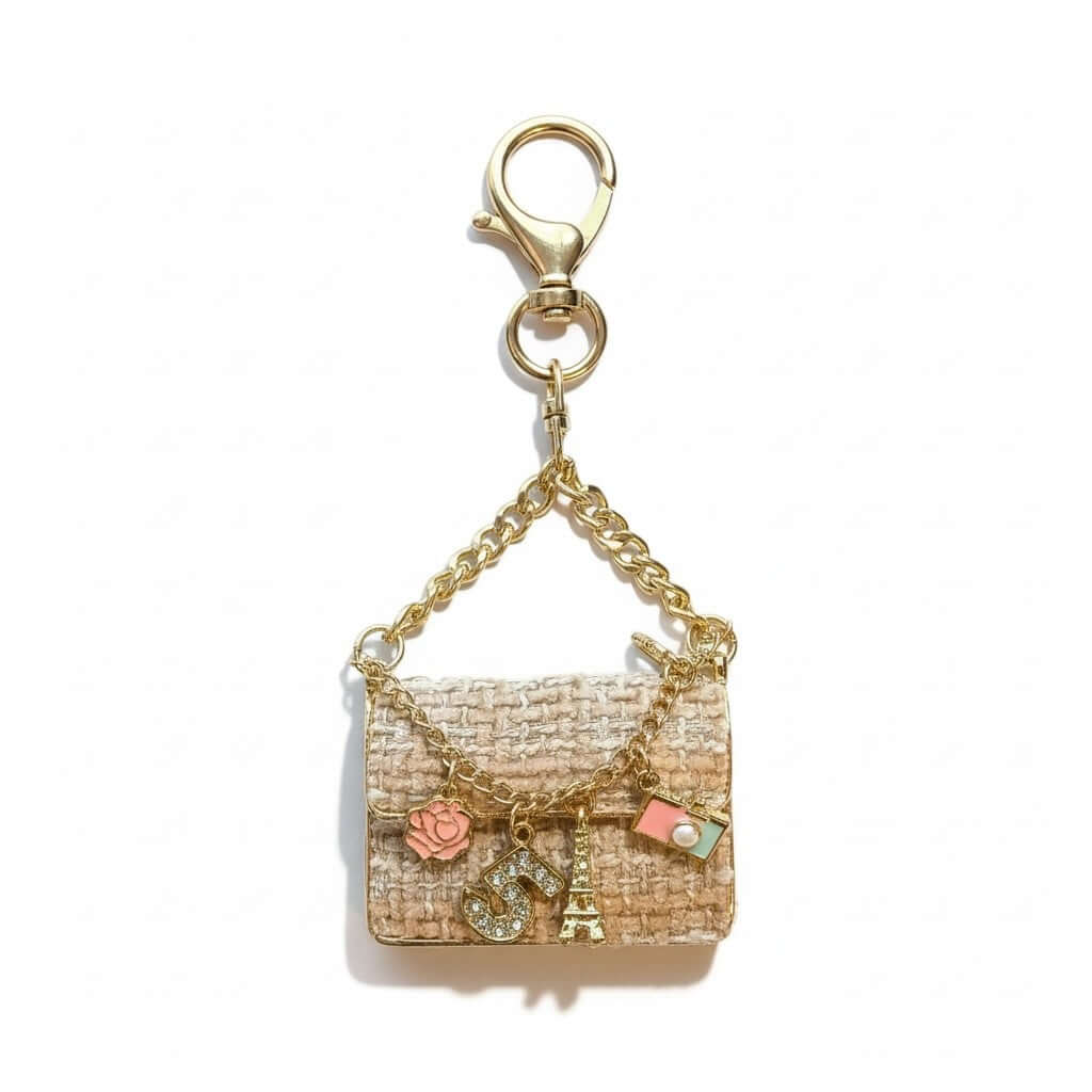Legacy Parisian Charm Mini in luxe tweed-style with gold chain details and iconic charms.
