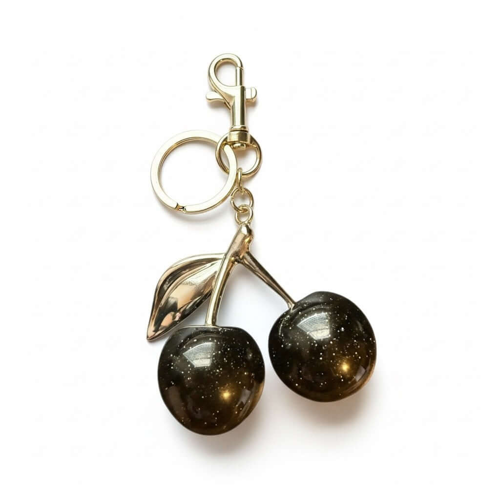 Legacy Ruby Cherry Charm featuring deep-ruby cherries with gold detailing for stylish accessories.