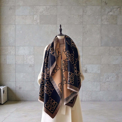 Legacy Luxe Signature Monogram Shawl – Brown or Black displayed draped elegantly on a mannequin.