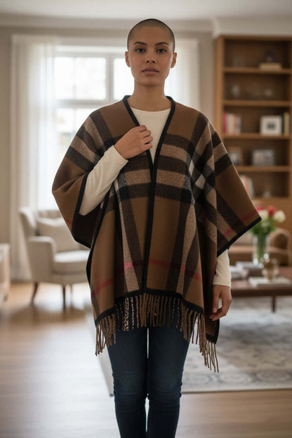 Heritage Plaid Luxe Poncho Shawl – One Size Cozy Fringe Wrap worn by a model, showcasing the stylish plaid design and fringe hem.