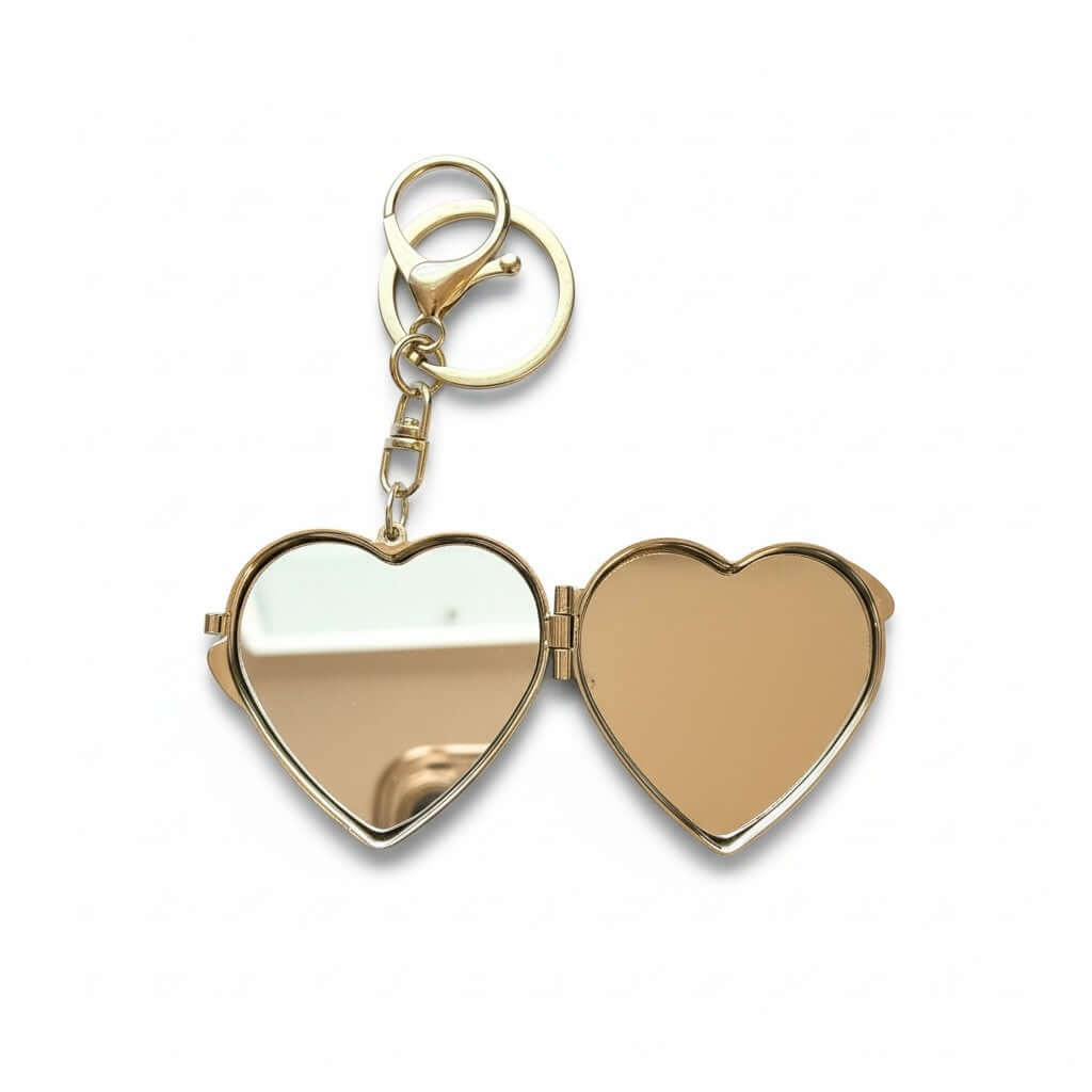 Legacy Blush Butterfly Locket Charm showing heart-shaped gold compact mirror opened for touch-ups.