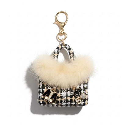 Legacy Noir Luxe Mini Charm featuring black faux fur, textured tweed, and gold enamel charms.