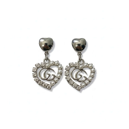 Silver Legacy Heart Pearl Earrings (Upcycled | One-of-One Statement Pair) featuring silver hearts and pearls.