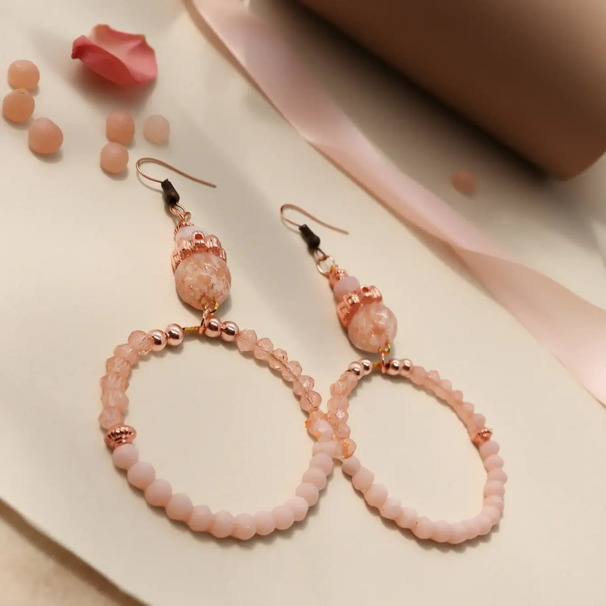 Elegant earrings from the Legacy Blush Luxe Duo featuring blush pink beads and rose-gold accents.