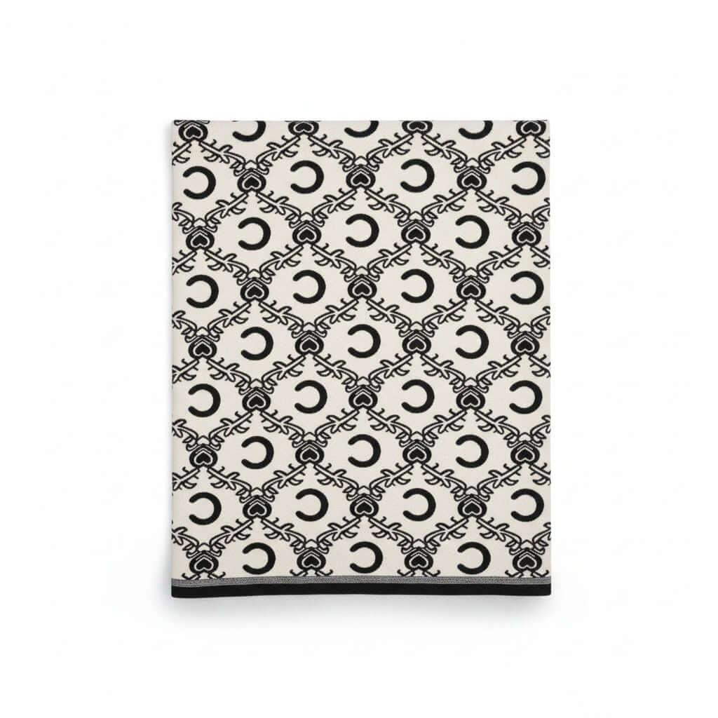Royal Heritage Emblem Wrap featuring a luxurious heritage-inspired emblem pattern on a soft fabric.