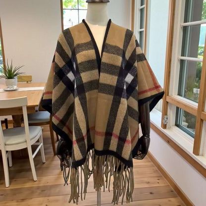 Heritage Plaid Luxe Poncho Shawl – One Size Cozy Fringe Wrap on display, showcasing a timeless plaid design and fringe hem.