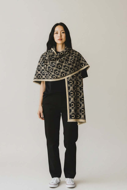 Model wearing the Royal Heritage Emblem Wrap shawl showcasing a heritage-inspired design and elegant style.