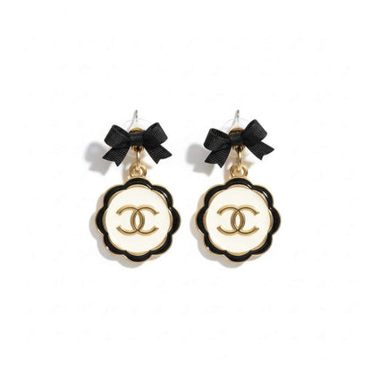 Noir Bow Cameo Upcycled Statement Earrings – One of One featuring a chic black bow and sculpted drop design.