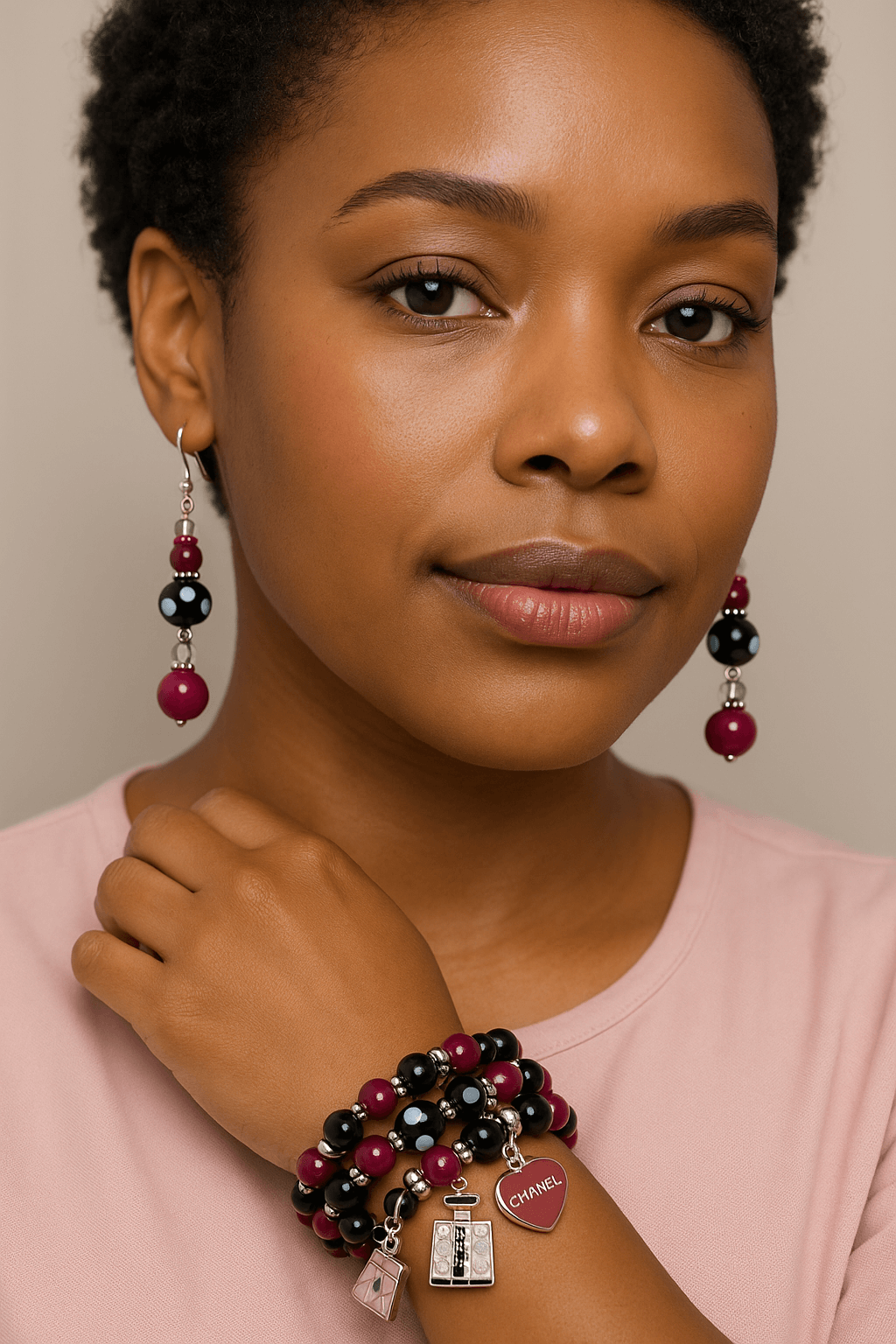 Legacy Pink Noir Duo Set – Handmade Fuchsia & Black Beaded Earrings + Charm Bracelet worn by a model.