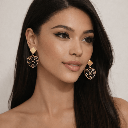 Noir Monogram Heart Drop Earrings (Upcycled • One of One) worn by a model showcasing their elegant design.