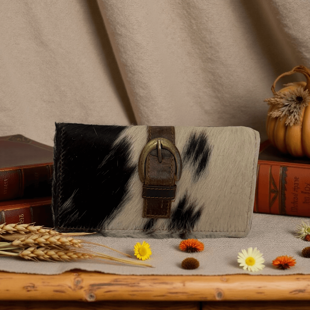 Cowhair Buckle Wallet featuring genuine cowhide leather with natural cowhair and a vintage-inspired buckle clasp.