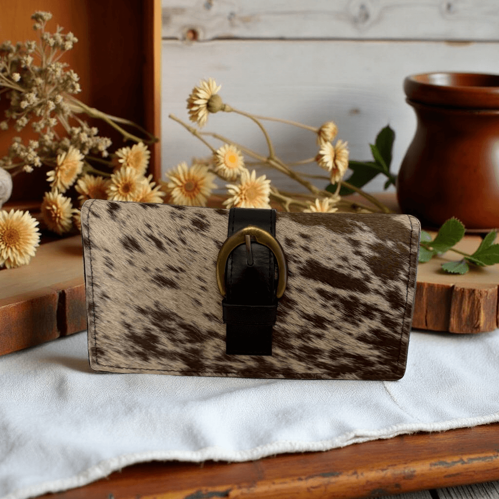 Cowhair Speckled Wallet handcrafted with speckled cowhide leather and classic buckle closure.