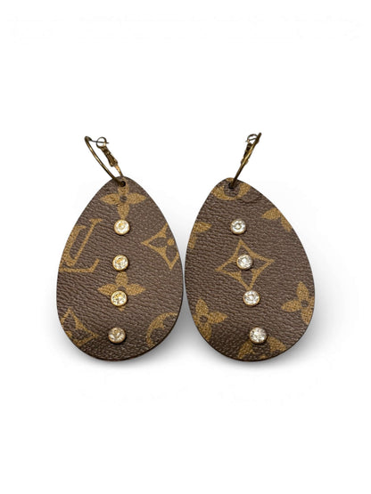 Heritage Halo Teardrop Earrings featuring upcycled material and sparkling crystals in a teardrop silhouette.