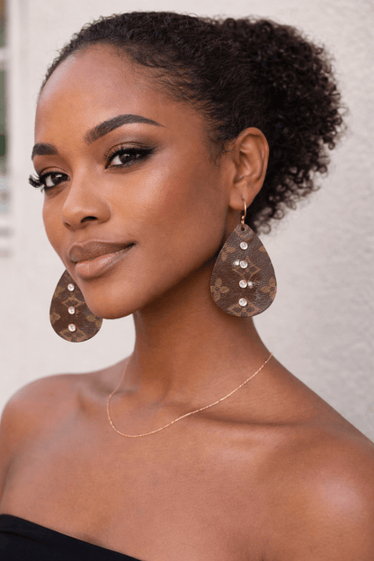 Model wearing Heritage Halo Teardrop Earrings showcasing their elegant design and sparkling crystal details.