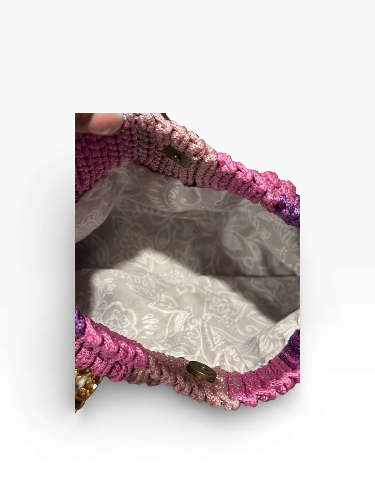 Inside view of the Seraphine Rose-Plum Crochet Bag featuring a soft crochet exterior and elegant lining.