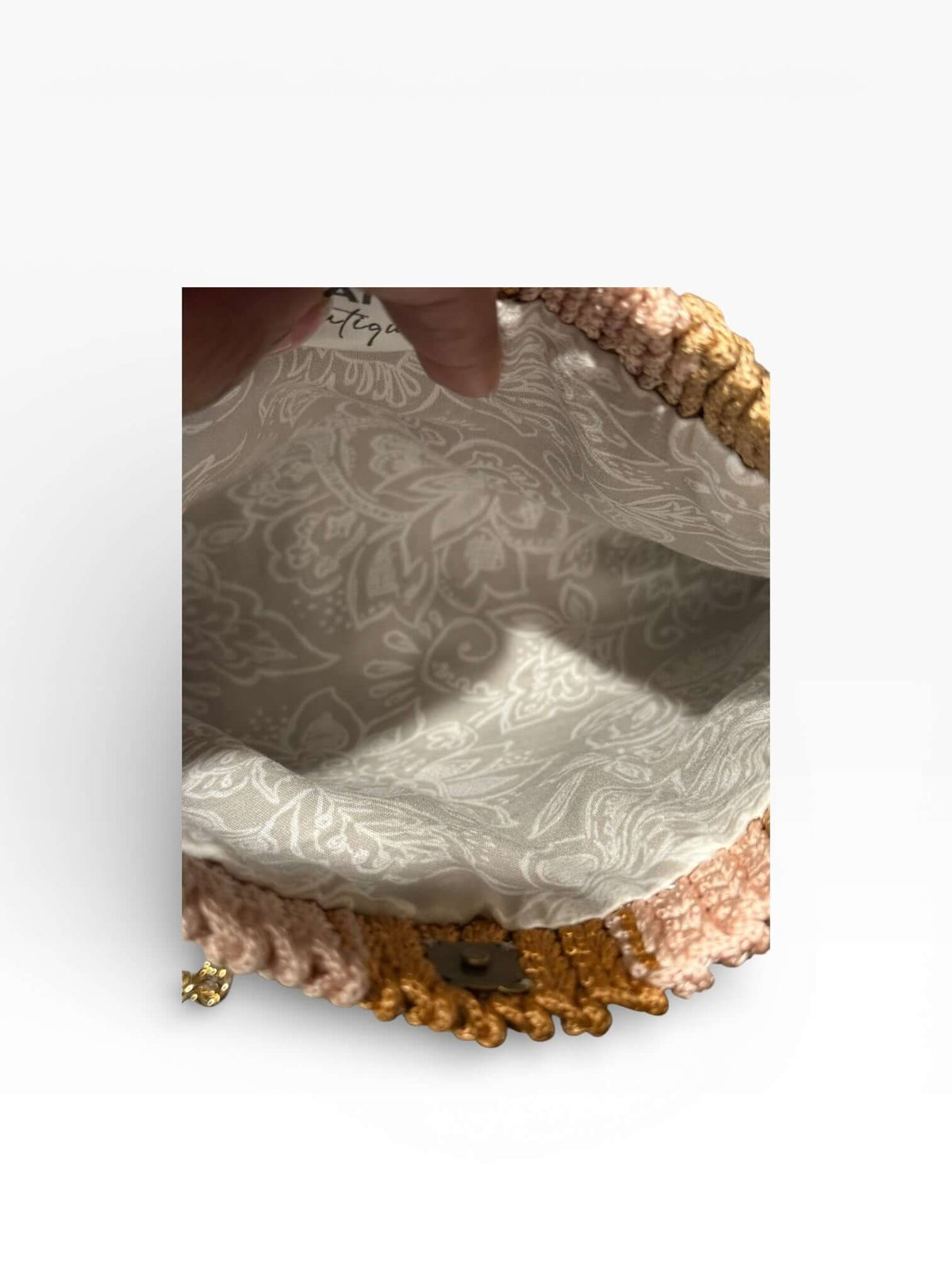 Interior view of the Solara Handcrafted Crochet Chain Crossbody showcasing its elegant lining and intricate crochet design.