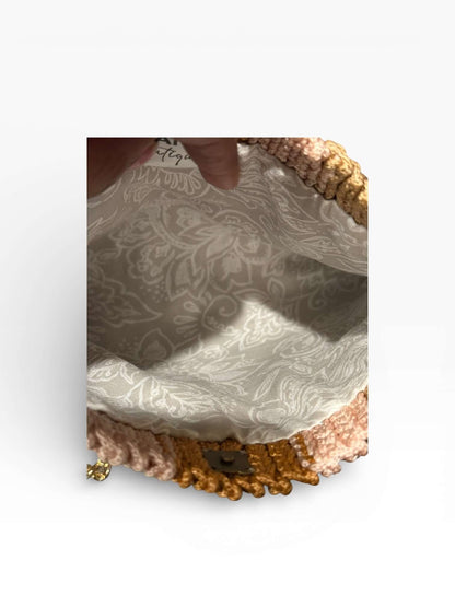 Interior view of the Solara Handcrafted Crochet Chain Crossbody showcasing its elegant lining and intricate crochet design.