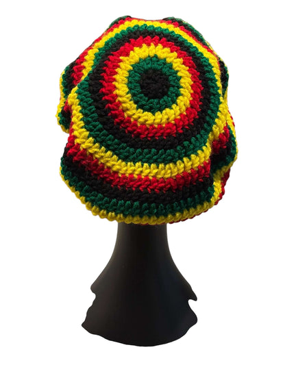 Rasta Rhythm Crochet Newsboy Cap & Statement Earring Set showcased on a mannequin, vibrant yellow, red, and green stripes.