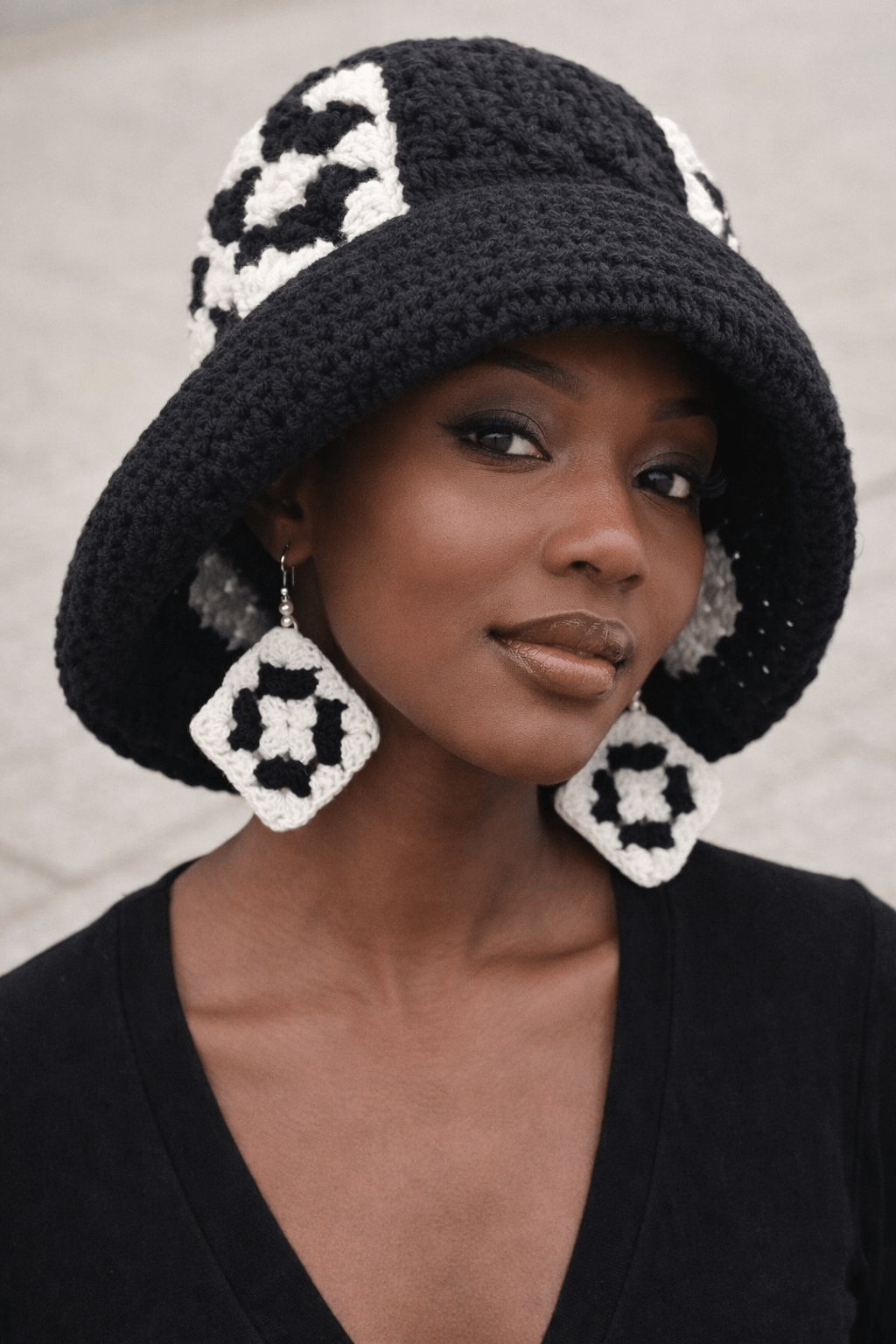 Midnight Mosaic Crochet Hat & Statement Earring Set worn by a model showcasing the unique design and texture.