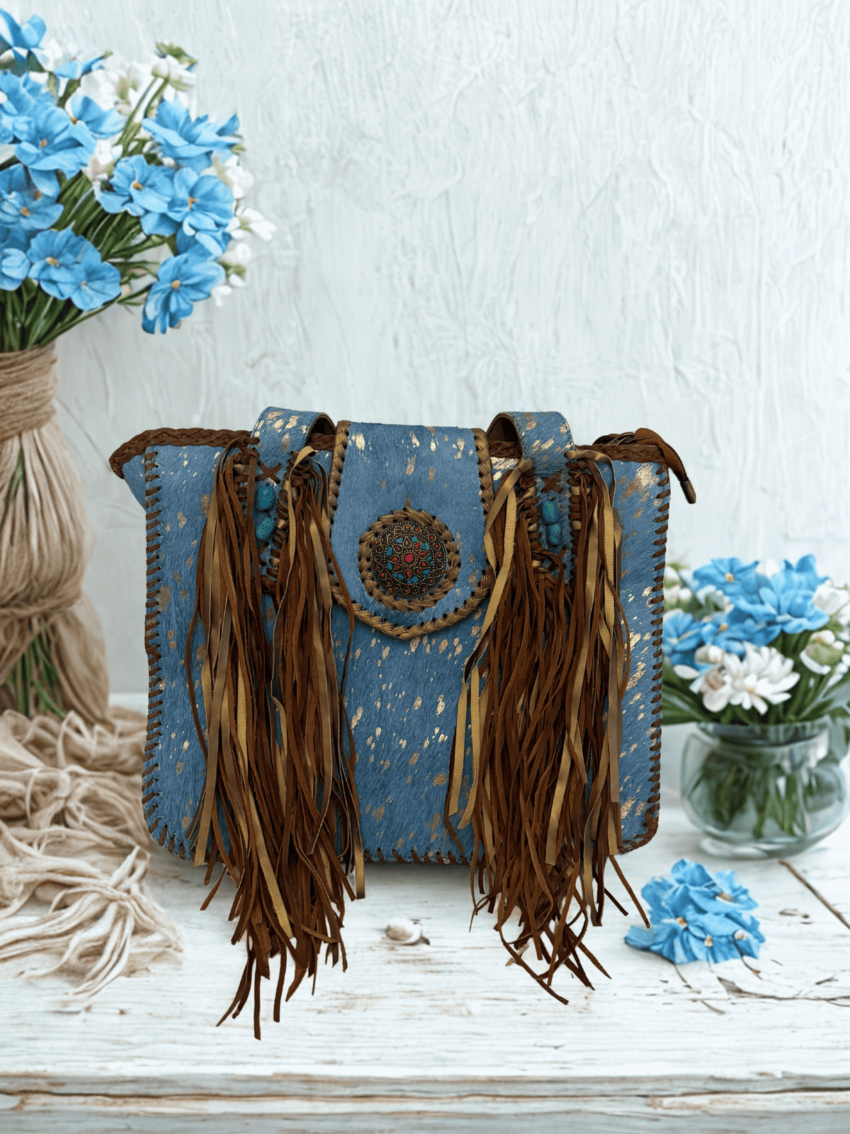 Michelle Bag- Blue featuring denim-blue base, cascading brown leather fringe, and intricate beading.