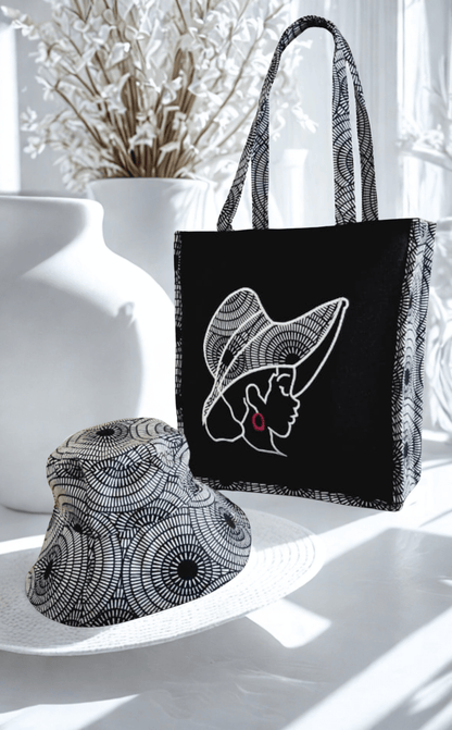 Mildred Multifunctional Hand Stitched Tote | Legacy Dealz Ancestry Collection next to a stylish hat.