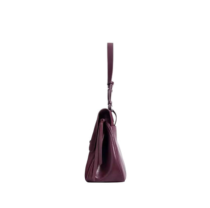 Side view of the Merlot Suede Elegance Bag in rich deep wine hue, showcasing its smooth silhouette and stylish details.