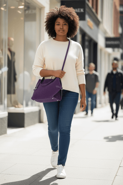 The Amara Two-Tone Crossbody | Suede & Leather Bag – Legacy Dealz worn by a stylish woman outdoors.