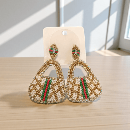 Mini Luxe Handbag Statement Earrings | Beaded Designer Style displayed on a surface with natural light.