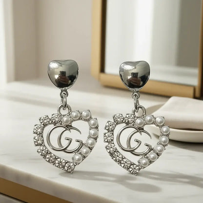 Silver Legacy Heart Pearl Earrings (Upcycled | One-of-One Statement Pair) with silver heart and pearls.