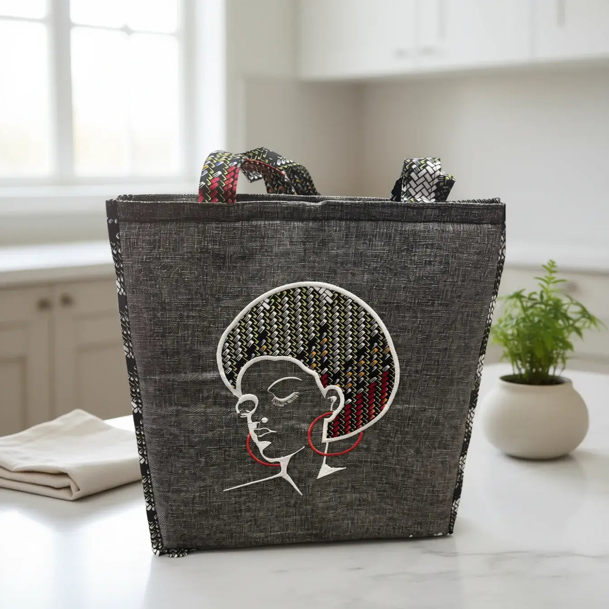 Angela Bag – Waterproof Hand-Stitched Multifunctional Tote | Amani Belle Collection with elegant embroidered silhouette.