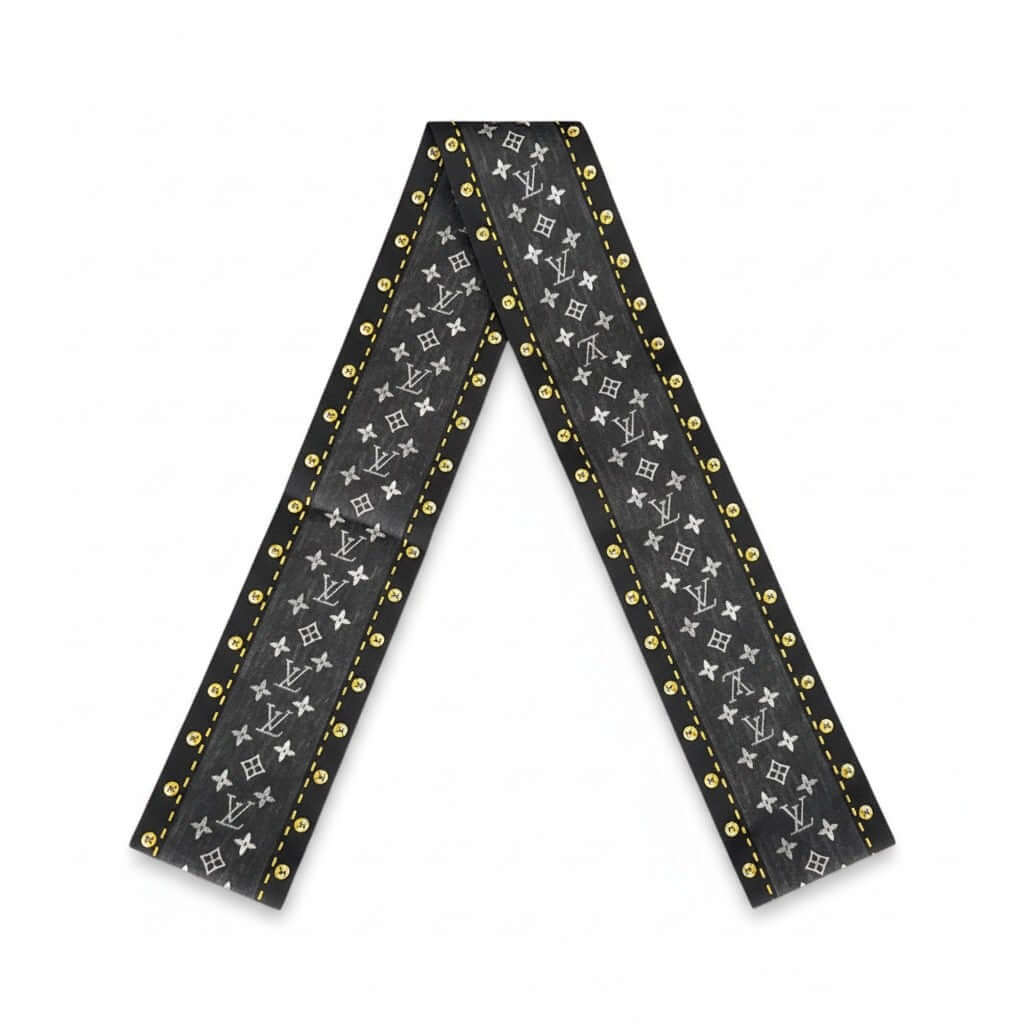 Legacy Noir Studded Monogram Twilly in black and grey with gold stud detailing.